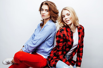 Image showing two pretty blond woman having fun together on white background, mature mother and young teenage daughter, lifestyle people concept