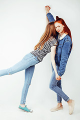 Image showing best friends teenage girls together having fun, posing emotional on white background, besties happy smiling, lifestyle people concept