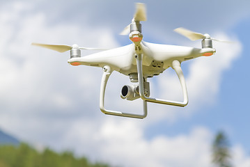 Image showing Drone flying above mountains