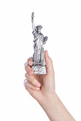 Image showing Hand holding a Statue of Liberty souvenir toy