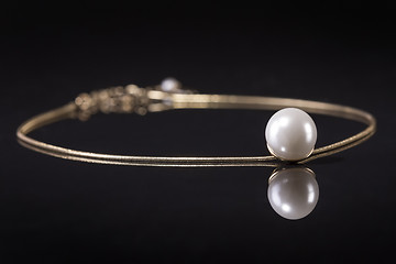 Image showing White pearls necklace on black background