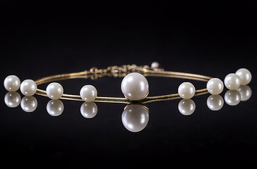 Image showing White pearls necklace on black background