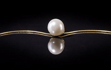 Image showing White pearls necklace on black background