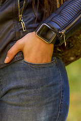 Image showing Young girl wears smart watch with touchscreen