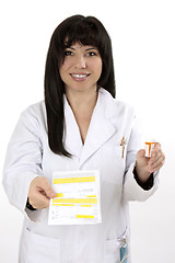 Image showing Pharmacist with prescription and medicine