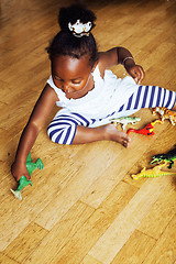 Image showing little cute african american girl playing with animal toys at ho