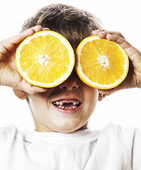 Image showing little cute boy with orange fruit double isolated on white smili