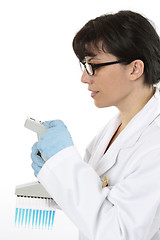 Image showing Scientist programming pipette