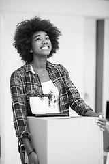 Image showing Black girl moving in the new apartment