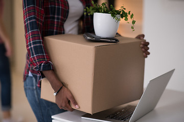 Image showing Black girl moving in the new apartment