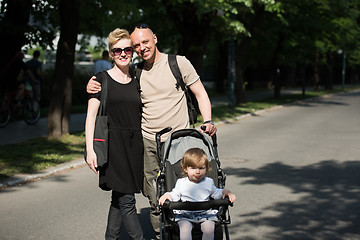 Image showing couple with baby pram in summer park