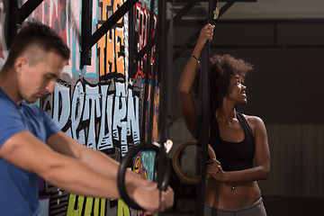 Image showing Portrait of multiethnic couple  after workout at gym