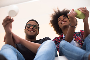 Image showing couple having break during moving to new house