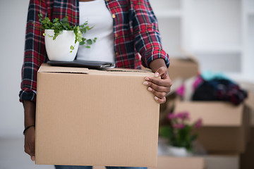 Image showing Black girl moving in the new apartment