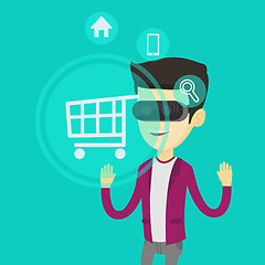 Image showing Man in virtual reality headset shopping online.