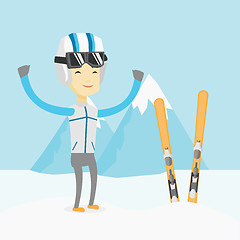 Image showing Cheerful skier standing with raised hands.