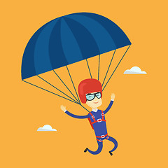 Image showing Young happy man flying with parachute.