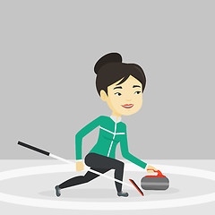 Image showing Curling player playing curling on curling rink.