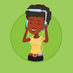 Image showing Young woman in headphones listening to music.