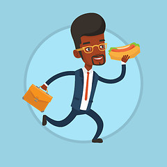 Image showing Businessman eating hot dog on the run.