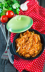 Image showing fried cabbage in bowl and on a table