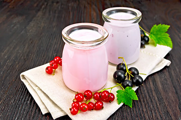 Image showing Milk cocktail with red and black currant on napkin