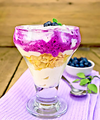 Image showing Dessert milk with blueberries on towel