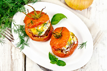 Image showing Tomatoes stuffed with meat and rice in plate on board top