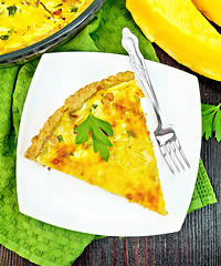 Image showing Quiche with pumpkin and bacon in plate on board top