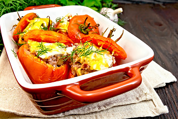 Image showing Tomatoes stuffed with rice and meat in brazier on towel