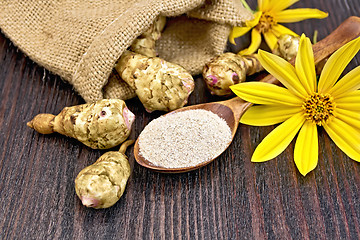 Image showing Flour of Jerusalem artichoke in spoon with flower on board