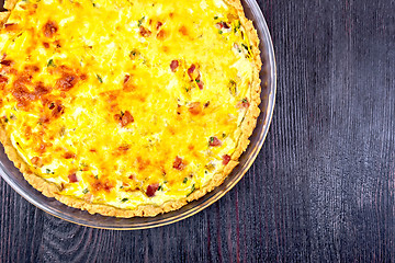 Image showing Quiche with pumpkin and bacon in pan on board top
