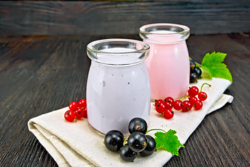 Image showing Milk cocktail with black and red currant on napkin