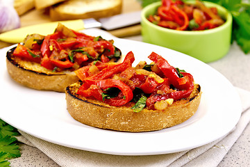 Image showing Bruschetta with vegetables in plate on granite table