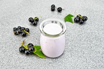 Image showing Milk cocktail with black currant on stone table