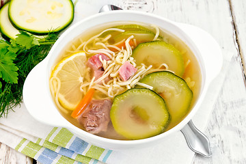 Image showing Soup with zucchini and noodles on napkin