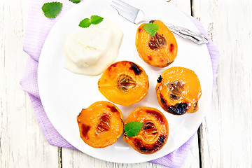 Image showing Quince baked in plate on board top