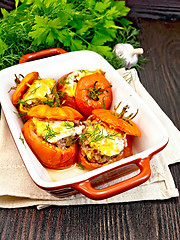 Image showing Tomatoes stuffed with rice and meat in brazier on napkin