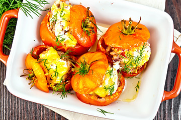 Image showing Tomatoes stuffed with rice and meat in brazier on board top