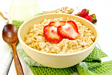 Image showing Oatmeal with strawberries on light board