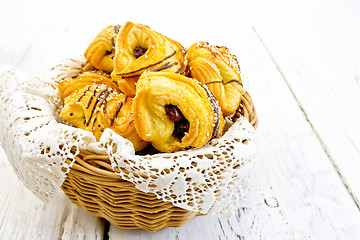 Image showing Cookies with dates in basket with napkin on light board