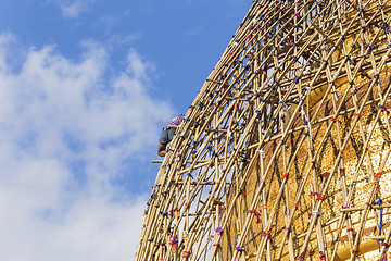 Image showing Worker repareing golden temple