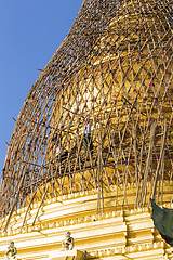 Image showing Worker repareing golden temple