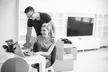 Image showing Young couple moving in a new home