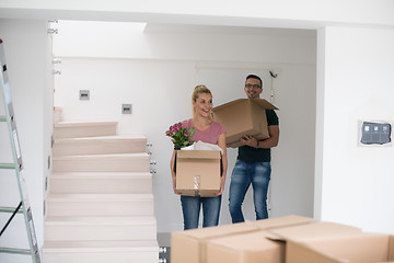 Image showing young couple moving into a new home