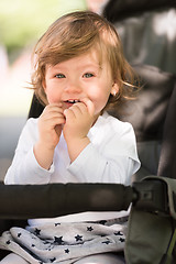 Image showing baby girl sitting in the pram