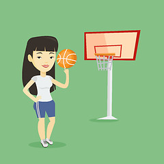 Image showing Young basketball player spinning ball.