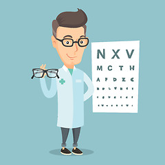 Image showing Professional ophthalmologist holding eyeglasses.