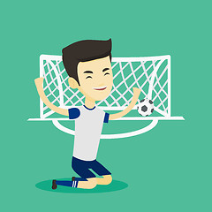 Image showing Soccer player celebrating scoring goal.