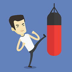 Image showing Man exercising with punching bag.